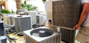Technician providing Heating and Cooling Services